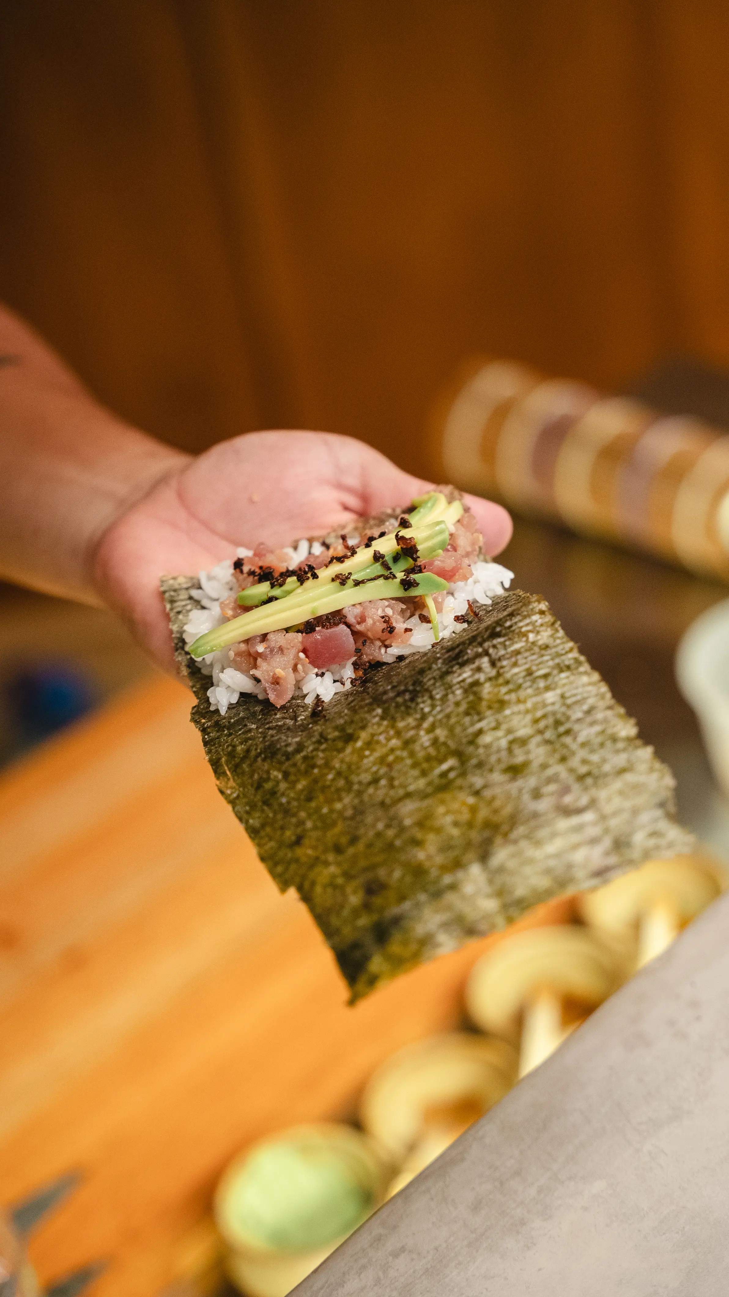 Chef at Yasumi preparing hand rolls with precision and balance