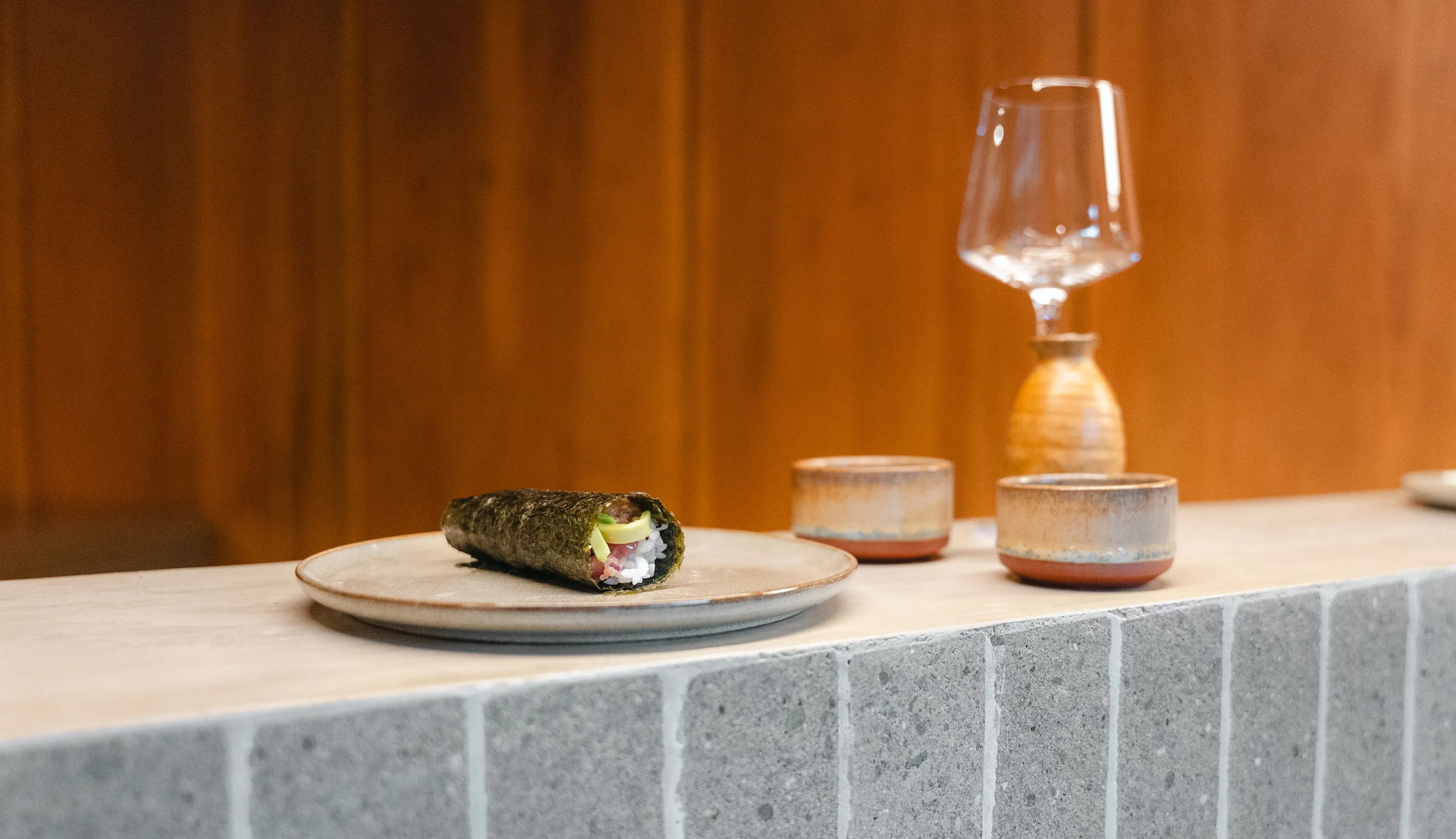 Chef preparing hand rolls at Yasumi sushi bar in Santa Teresa