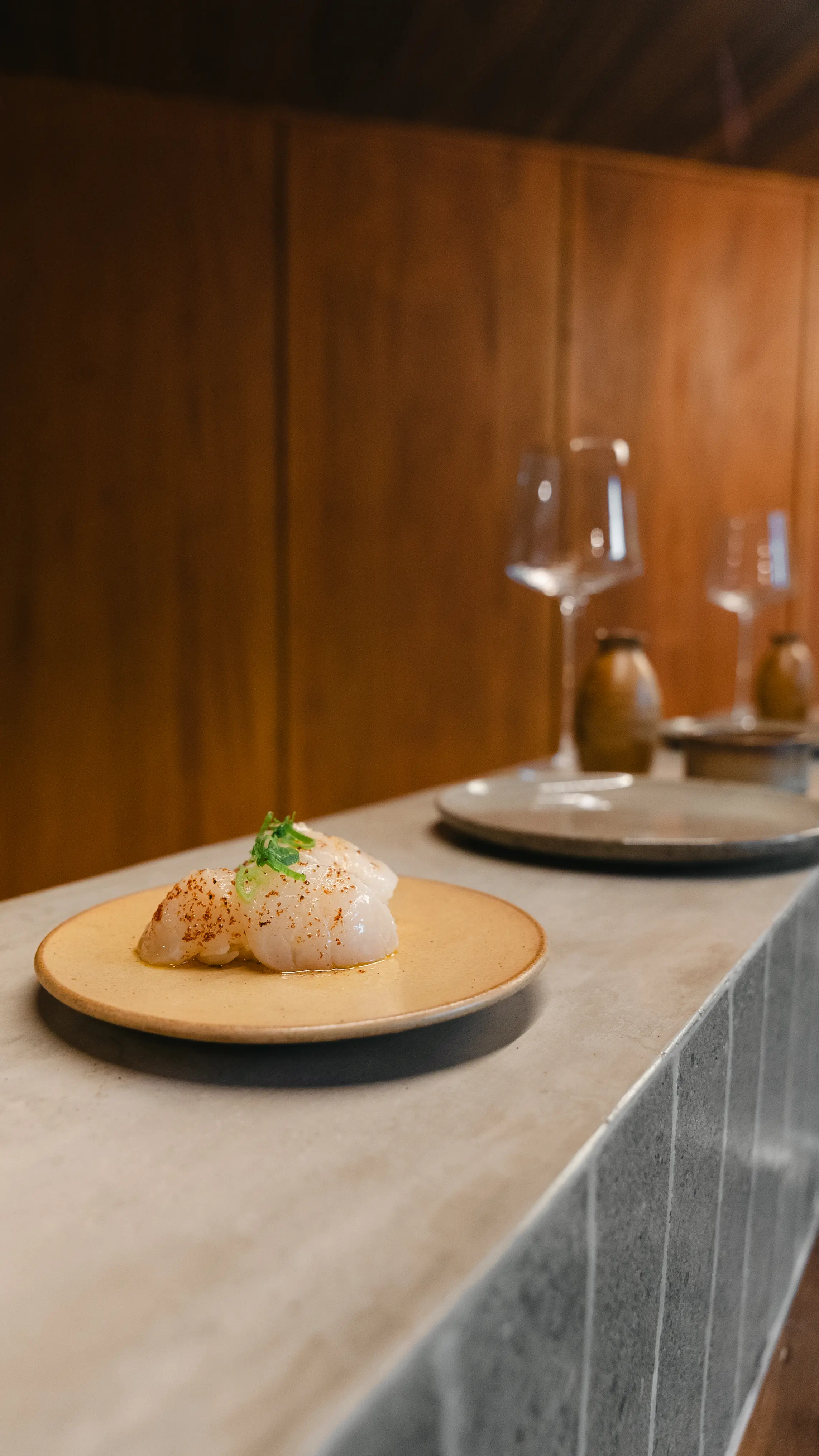 Scallop nigiri torched with golden butter and truffle oil at Yasumi